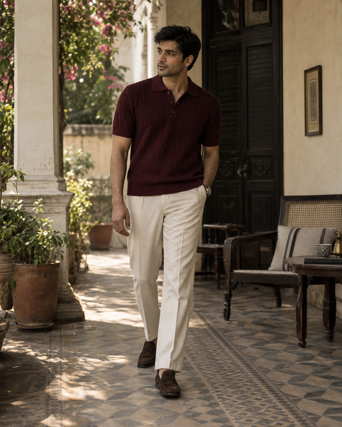 Pakistani menswear model wearing an oxblood textured knit polo in Lahore